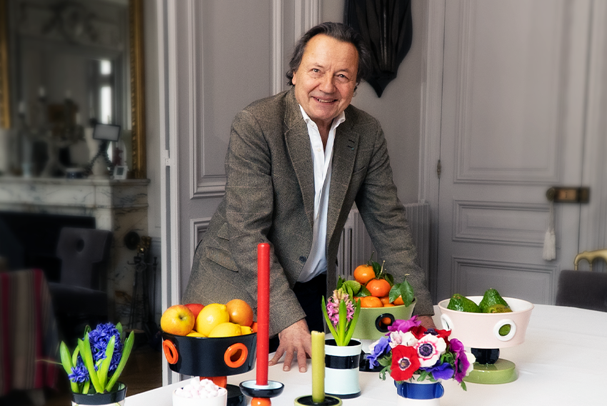 Olivier Ganère standing in front of some of his designs